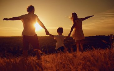 depositphotos_201719632-stock-photo-rear-view-of-family-standing